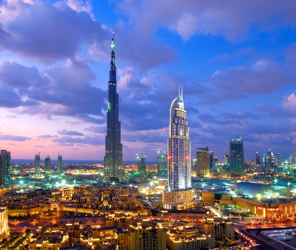 Burj Khalifa towers over the Dubai skyline at sunset